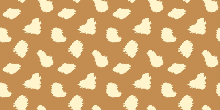 Seamless pattern with animal print in warm beige tones. Creamy colored deer skin design background with irregular textured spots for textiles, wallpapers, wrapping paper, fabric.