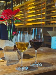 Wine Glasses Filled with Red and White Wine in a Wine Cellar Setting