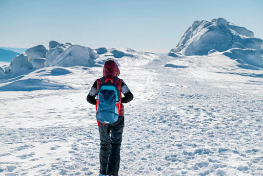 Senior man hiking in the winter mountain  - Powered by Adobe
