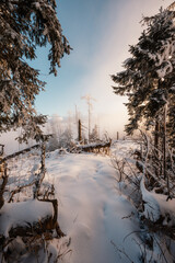 Winter hiking to Sina in Low Tatras National park near jasna is full of beautiful views. Sunset in Slovakia mountains with Chopok peak.