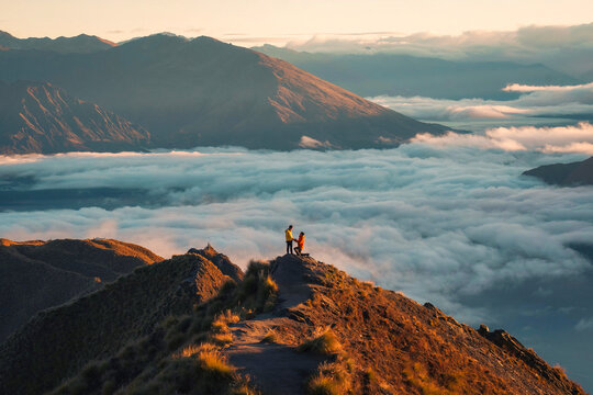 Couple marriage proposal on summit of Roys Peak, surrounded by foggy in the morning
