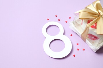Colorful bento cake and number eight on color background
