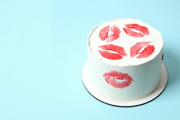 Fototapeta premium Colorful cake decorated with red lips on colorful background