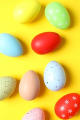 Easter decor concept. Top view photo of colorful eggs, close up