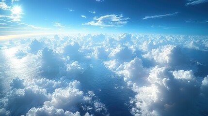Naklejka premium A Serene Aerial View of Soft White Clouds Amidst a Vibrant Blue Sky Over the Crystal Clear Ocean During a Bright Midday