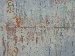 rough iron gray surface with bright orange rusty cracks in structure, grunge background in gray-copper tones textured relief, graphic resource of metal sheet with corrosion