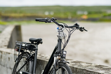 Electric bikes parked on Inishmore, the largest of the Aran Islands in Galway Bay, Ireland. Renting a bicycle is the most popular way to get around Inis Mor.