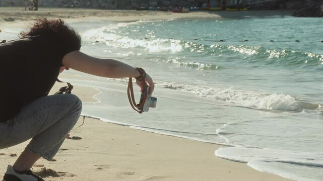 girl taking pictures of sea