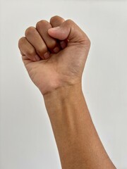 A clenched hand, isolated against a white background. Suitable for concepts of choice, action, strength, or communication
