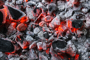 Smoldering embers of charcoal, preparation for barbeque. Charcoal background.
