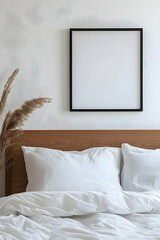 Minimalist Bedroom Decor: Blank Frame Above White Bedding