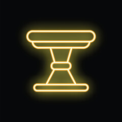 Glowing yellow silhouette of a coffee table on a black background