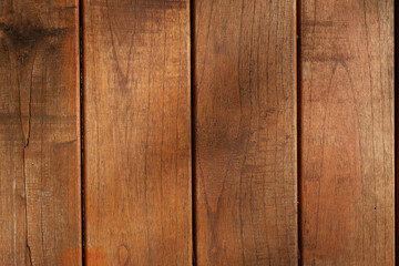 Brown wooden planks with visible wood grain, suitable for backgrounds in rustic or naturalthemed designs, furniture concepts, or carpentry projects.