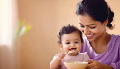 indian mother feeding food to baby