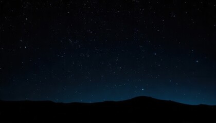 Naklejka premium Serene Night Sky Over Silhouetted Mountains