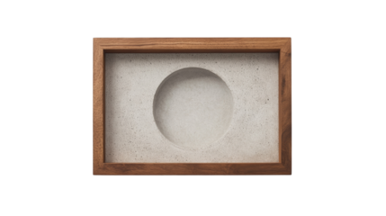 A simple modern frame made of wood contains a light grey concrete insert with a recessed oval shape.