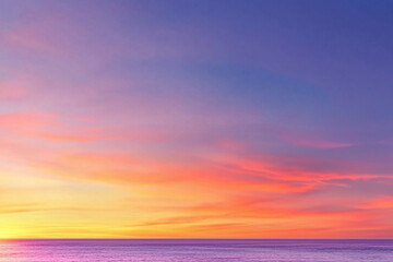 Fototapeta premium stunning gradient of sunset colors transitioning from orange to purple over calm ocean, creating serene and peaceful atmosphere