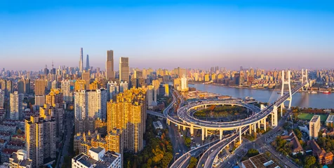 Papier peint photo Aerial view of Nanpu bridge across Huangpu river at sunset