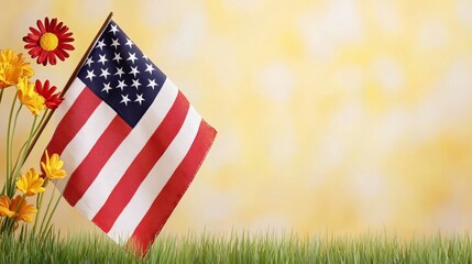 Flag standing among colorful flowers in green grass under a bright blue sky