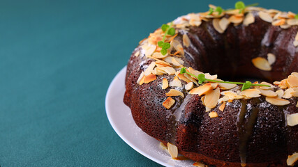 Beetroot chocolate bundt cake with fresh mint leaf. Tasty vegetarian dessert, breakfast or lunch. Delicious healthy pastry.