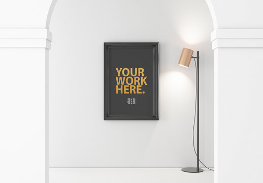 Vertical poster with black frame mockup hanging on wall