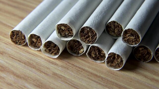 New cigarettes lying on the surface, close-up