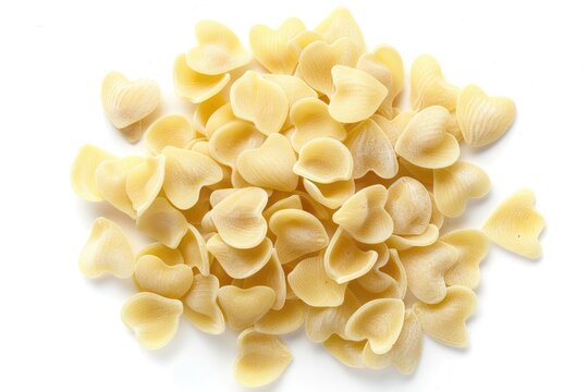 Heart Shaped Pasta Cuoricini Dry Uncooked Pile Isolated on White Background. Italian Food Ingredient and Valentine Cuisine Concept.