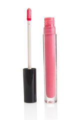 Obraz premium Pink lip gloss bottle isolated on a white background