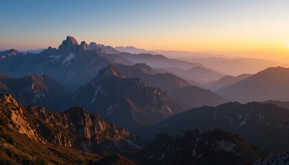 Obraz premium A breathtaking vista of a mountain range bathed in the warm hues of sunrise