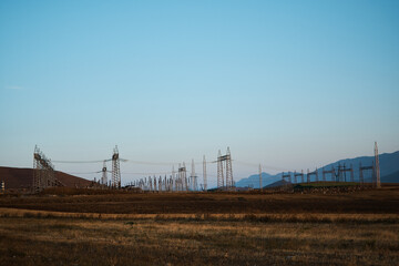 the power poles in the desert of Armenia with a view of the mountains
