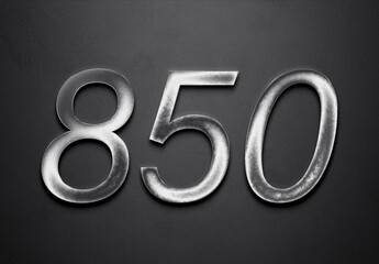 Chrome metal 3D number design of 850 on grey background.