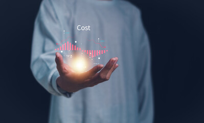 Business pointing down arrow of the graph with cost reduction business finance on virtual screen. Cost reduction concept.
