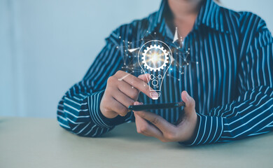 Hand of  holding illuminated light bulb, Idea innovation and inspiration concept.  creativity with bulbs that shine glitter, Concept for success.