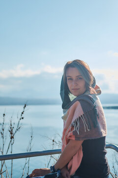 a young woman in scarf Sevanavank, monastery on lake Sevan, armenia