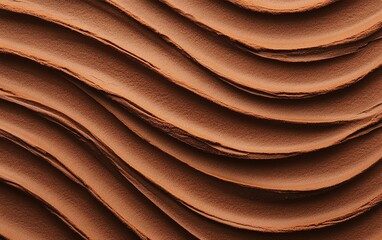 Fototapeta premium Smooth chocolate texture with elegant waves, perfect for culinary designs and desserts.