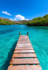 Fototapeta premium Tranquil Jetty Stretching into Calm Turquoise Waters at a Serene Beach