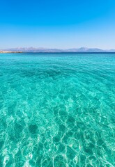 Obraz premium Serene Shallow Lagoon with Crystal Clear Waters under Bright Blue Sky