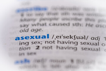 Asexual word in a dictionary. Selective focus, close up.