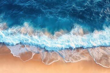 Fototapeta premium Aerial view of beautiful beach with turquoise water, splashing waves. Sandy shore meets blue ocean. Sunlight highlights waves. Relaxing scene. Perfect holiday destination. Vibrant tropical landscape.