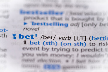 Bet word in a dictionary. Selective focus, close up.