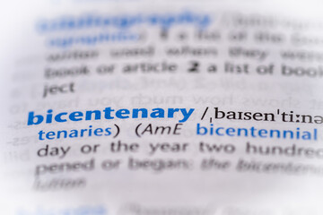 Bicentenary word in a dictionary. Selective focus, close up.