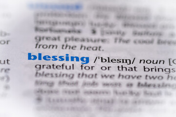 Blessing word in a dictionary. Selective focus, close up.