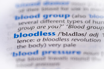 Bloodless word in a dictionary. Selective focus, close up.