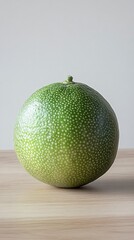Green lime fruit on a wooden table with a white background. Stock photo contest winner, high resolution,