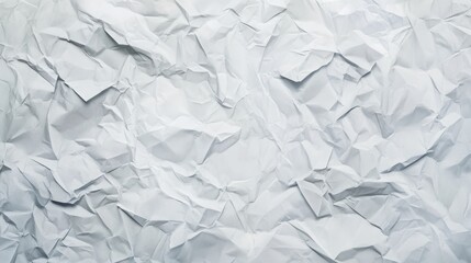 Obraz premium Crumpled white paper background creates a textured surface for crafting