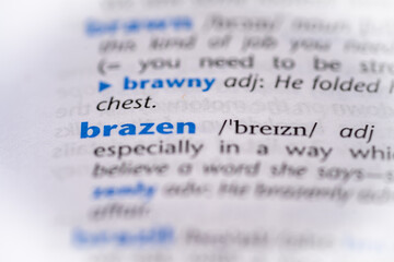 Brazen word in a dictionary. Selective focus, close up.