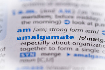 Amalgamate word in a dictionary. Selective focus, close up.