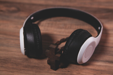 modern wireless headphones on wooden table with wooden table