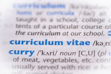 Curriculum vitae word in a dictionary. Selective focus, close up.