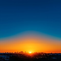 Naklejka premium Vibrant Sunset Over City Skyline with Silhouetted Buildings